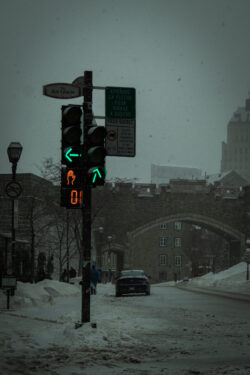 Image of a snowy crosswalk with focus on street lights